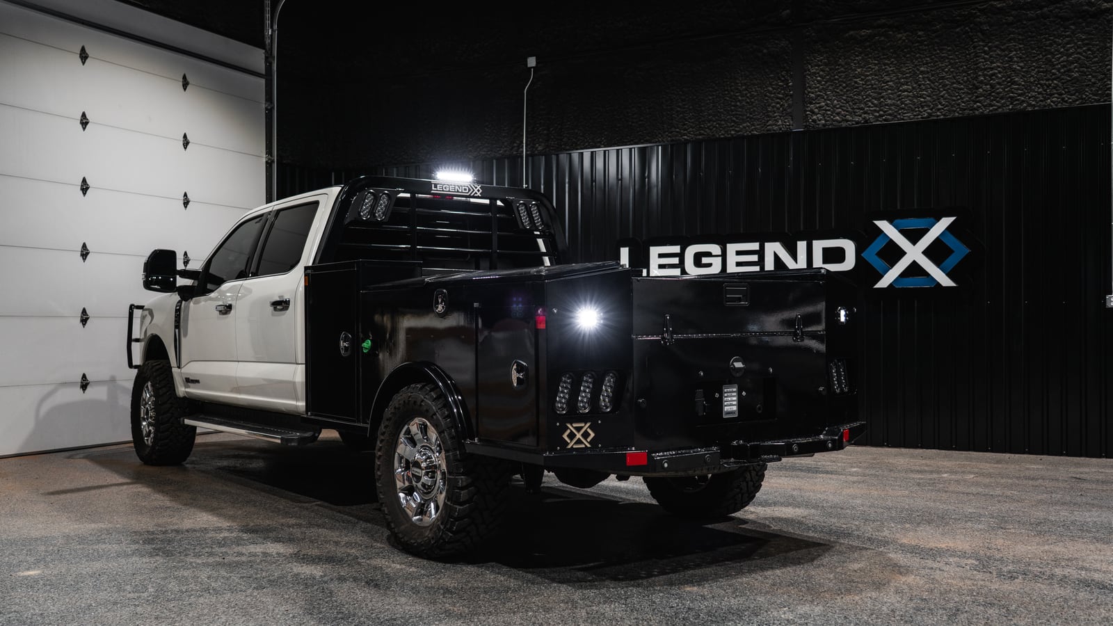 Black Legend X Apollo service body indoors with all three LED work lights illuminated.