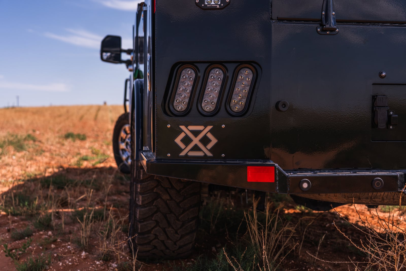 Close rear detail of Apollo LED tail lights and the Legend X badge.