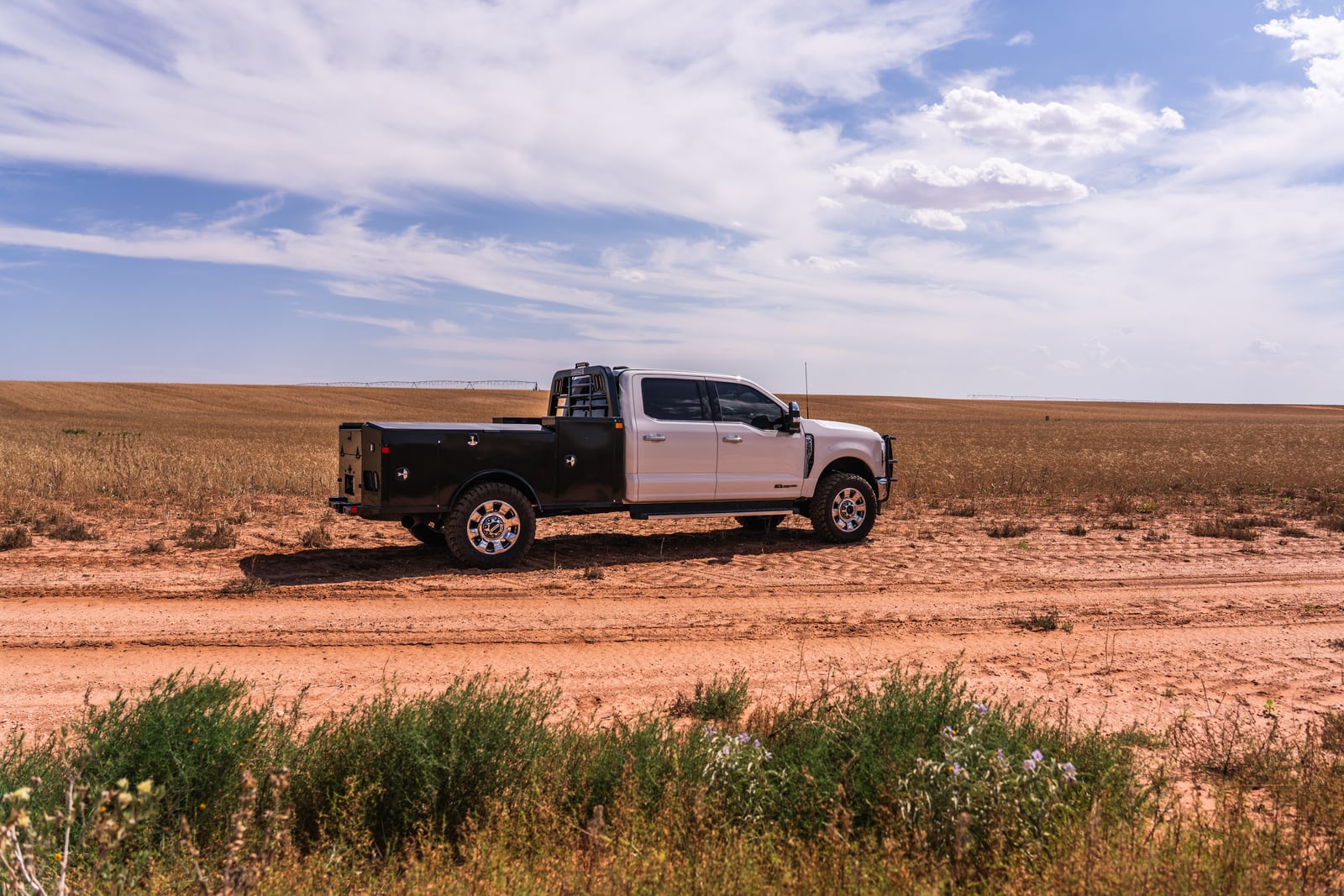 Legend X Apollo work truck shown in profile beside an open West Texas field.