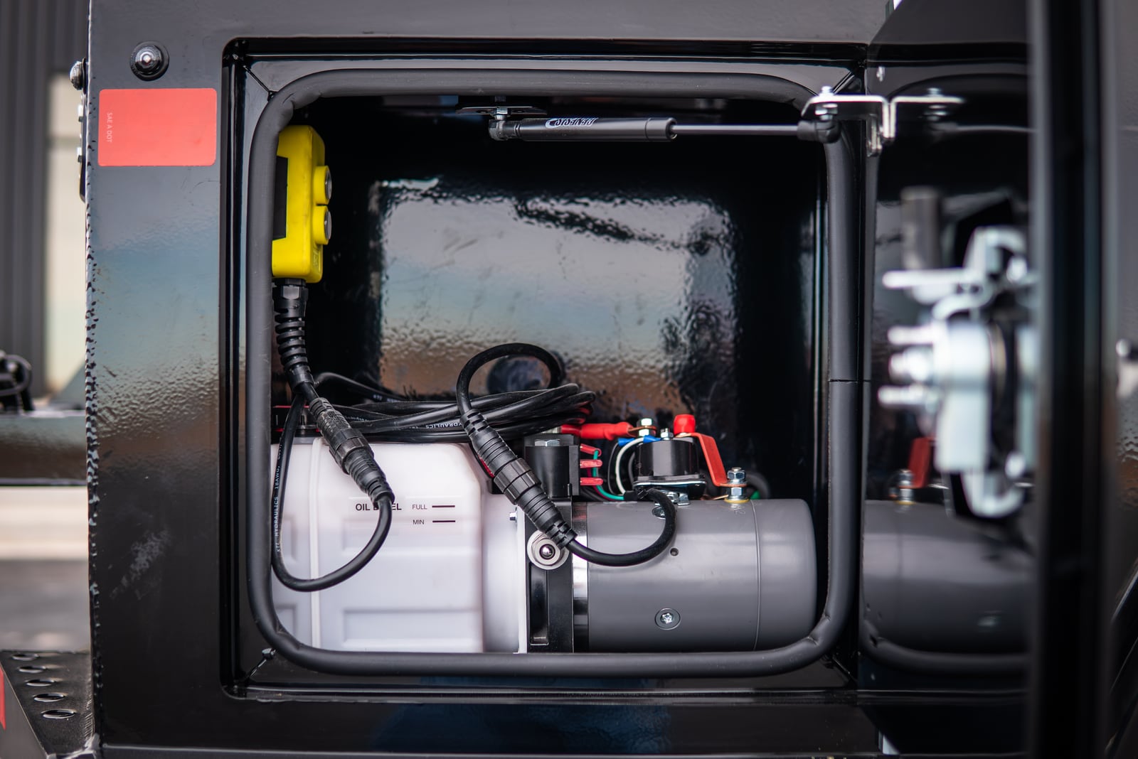 KTI hydraulic pump installed inside a Legend X Apollo service-body compartment.