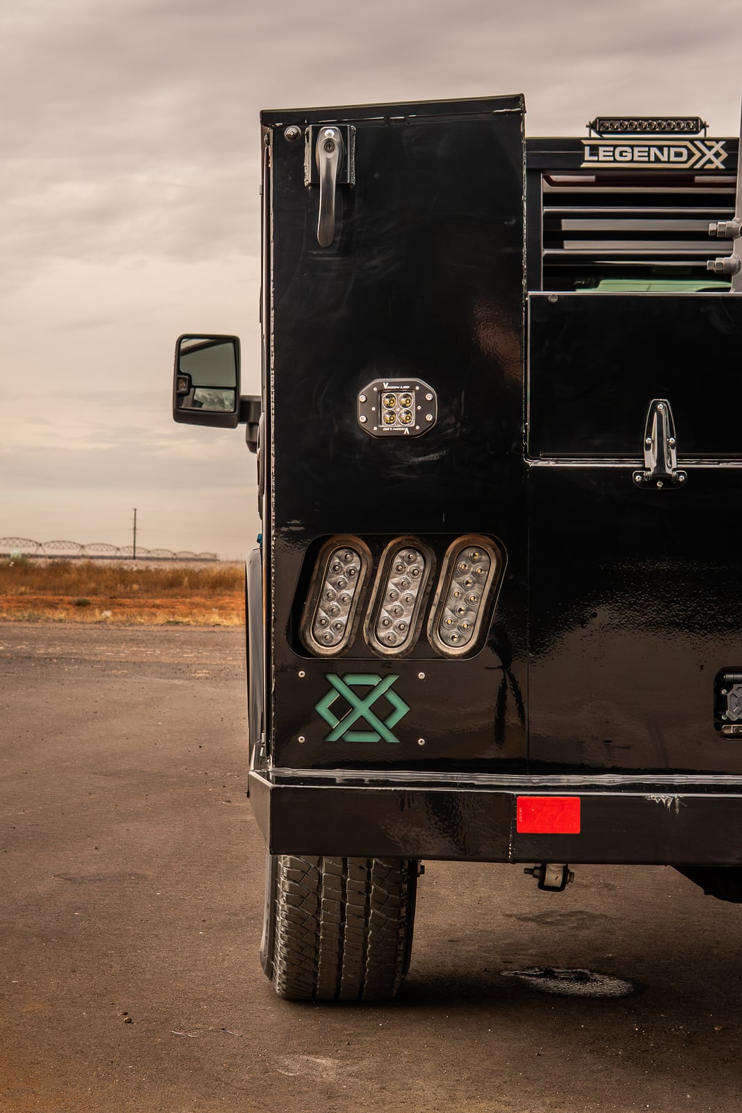 Portrait rear detail of a black Legend X Titan service body.