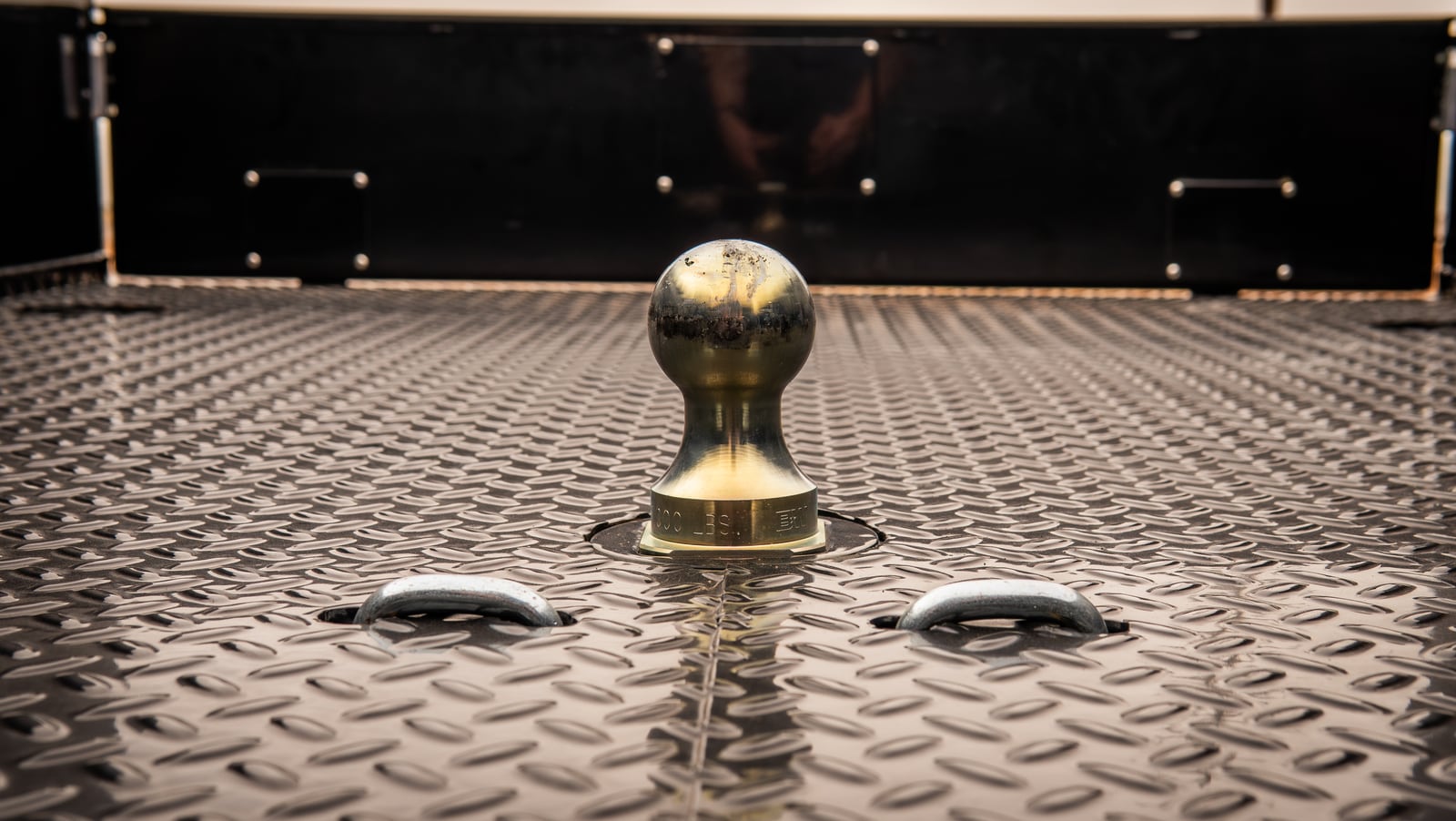 Gooseneck ball and safety-chain points in the Titan treadplate deck.