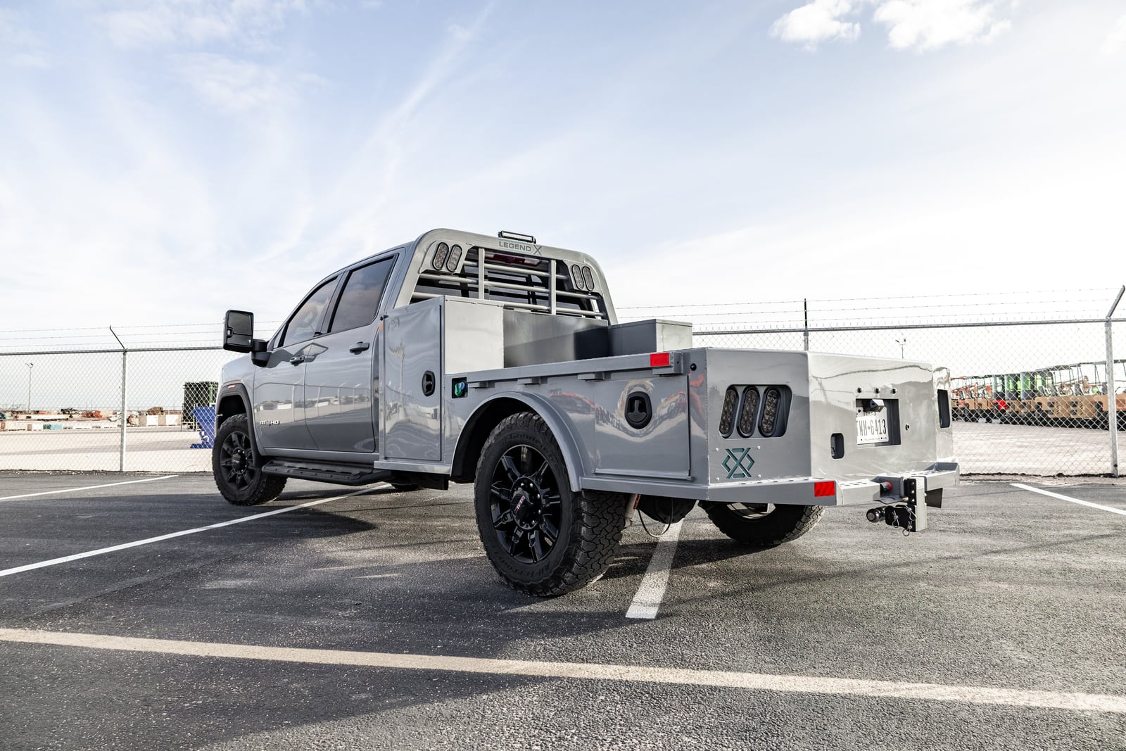 Gray pickup with a color-matched Legend X Viking Pro bed viewed from the rear.