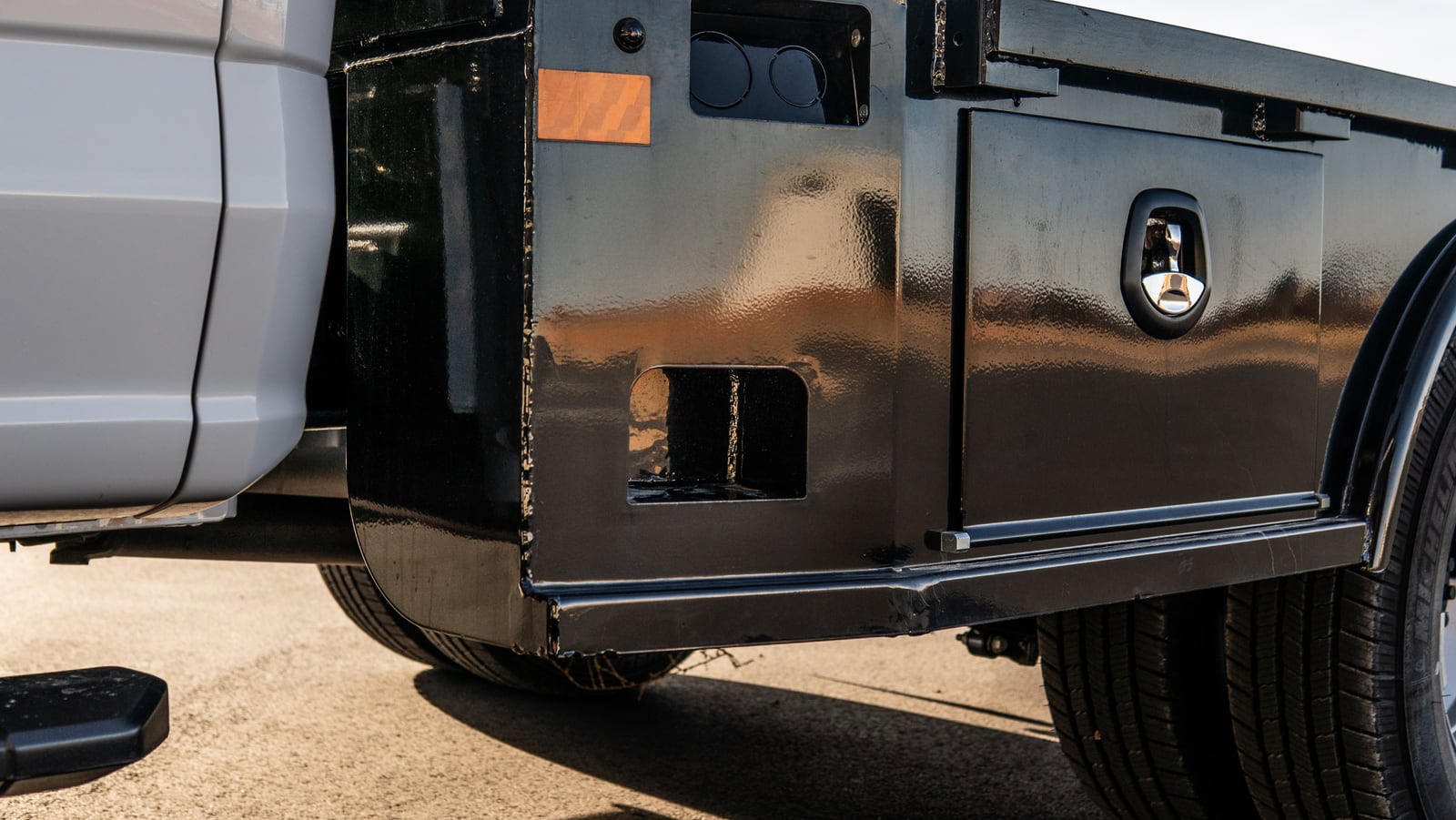 Integrated side step cut into the front side of a black Legend X Viking bed.