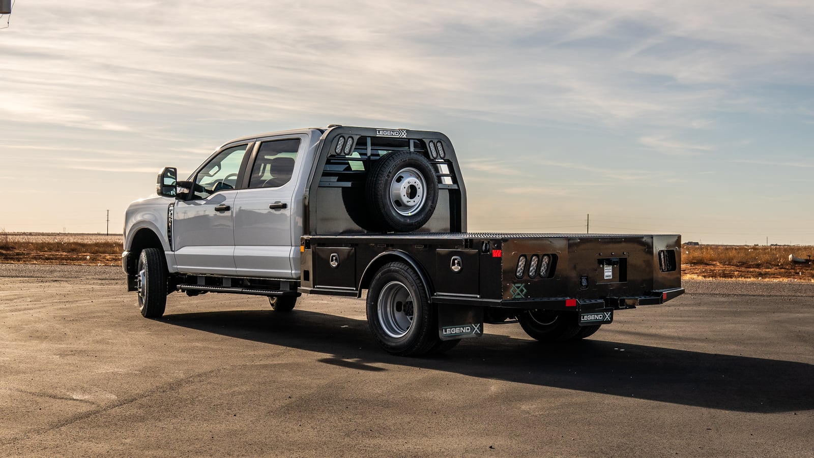 Rear three-quarter view of a Legend X Viking work truck in motion.
