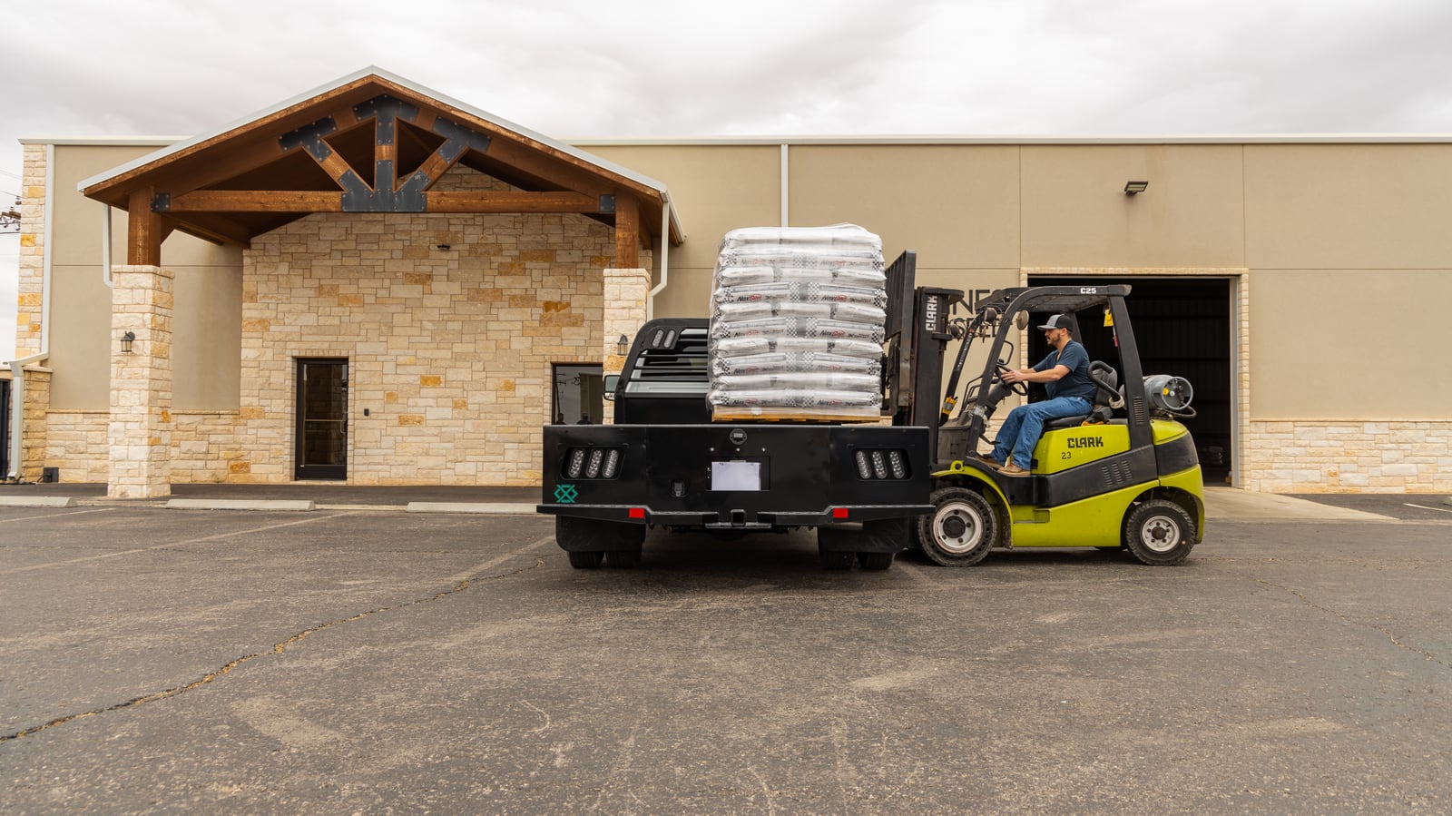 Legend X Viking flatbed positioned for pallet loading by a forklift.